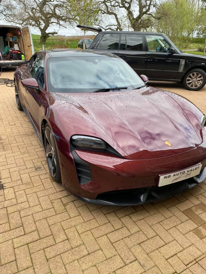 Maroon Porsche after a full valet